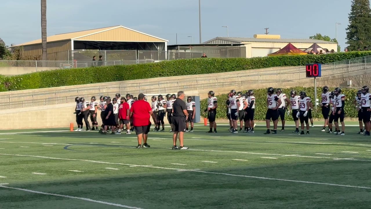 Coach Logan getting the boys warmed up and ready to take on Servite in