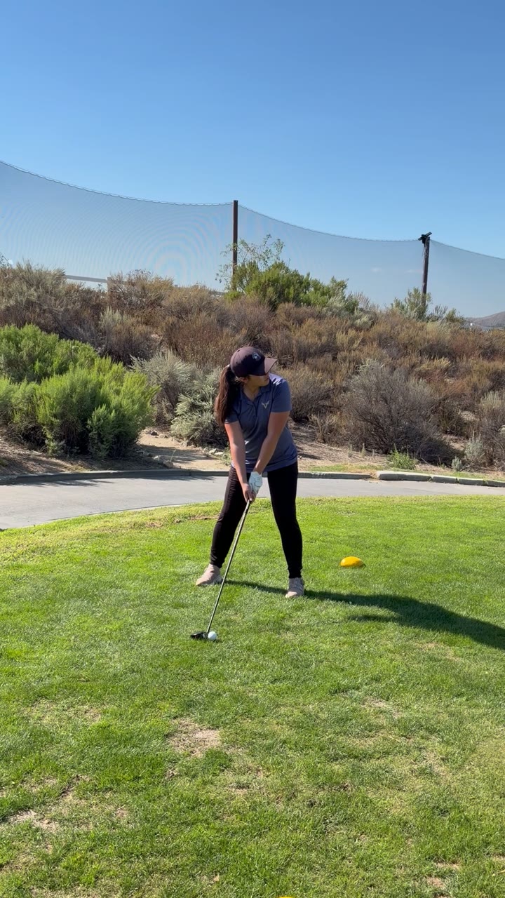 Kiara with a tee shot at Sand Canyon.