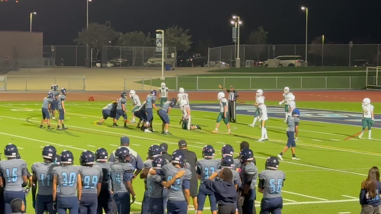 Quarterback, Caleb #12, runs the ball for a touchdown.