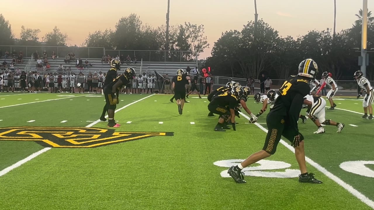 #2 Spencer on the run for a Capo first down